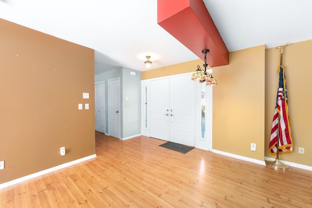 foyer with light wood-type flooring