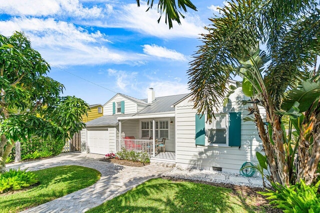 view of front of property featuring a porch and a garage