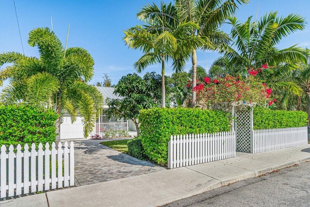 view of gate with a garage