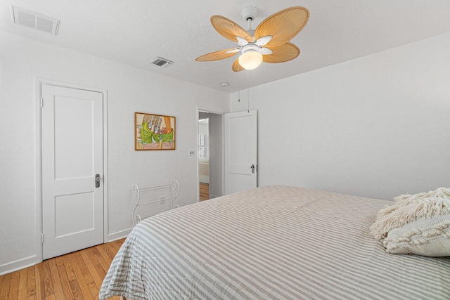 bedroom featuring hardwood / wood-style floors and ceiling fan