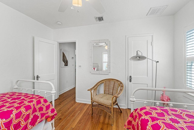 bedroom featuring hardwood / wood-style floors and ceiling fan