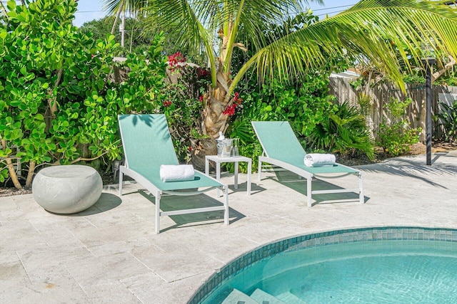 view of swimming pool with a patio area