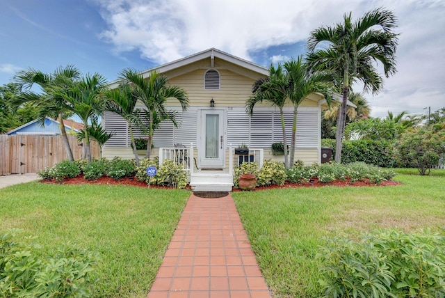 view of front of property with a front lawn