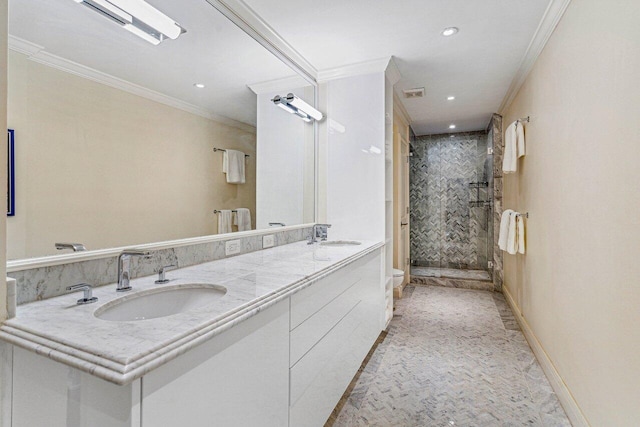 bathroom with toilet, vanity, a shower with shower door, and ornamental molding