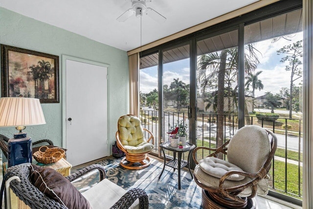 sunroom / solarium with ceiling fan and a healthy amount of sunlight