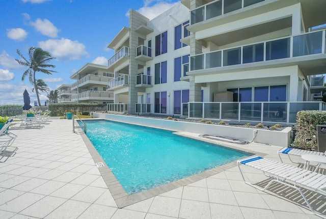 view of swimming pool with a patio area