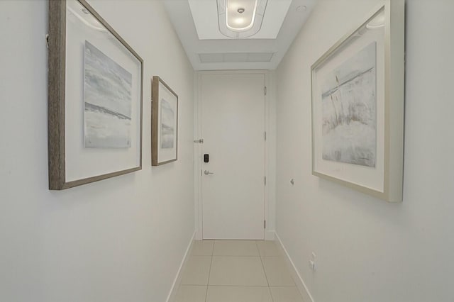 hall featuring light tile patterned floors