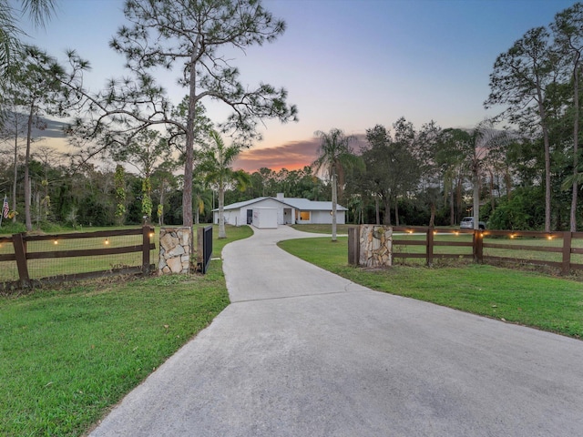 view of front of property with a yard