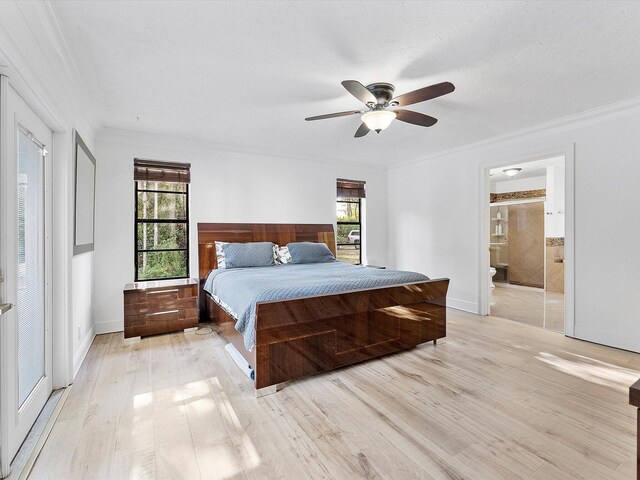 bedroom featuring ornamental molding, connected bathroom, ceiling fan, and light hardwood / wood-style flooring