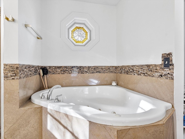 bathroom featuring tiled tub