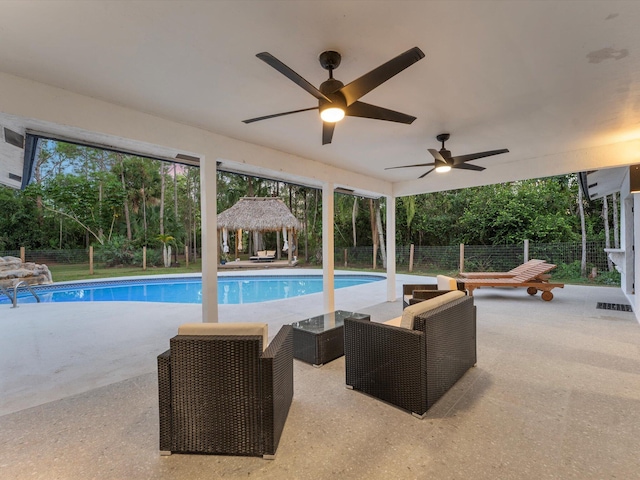 pool at dusk with a patio