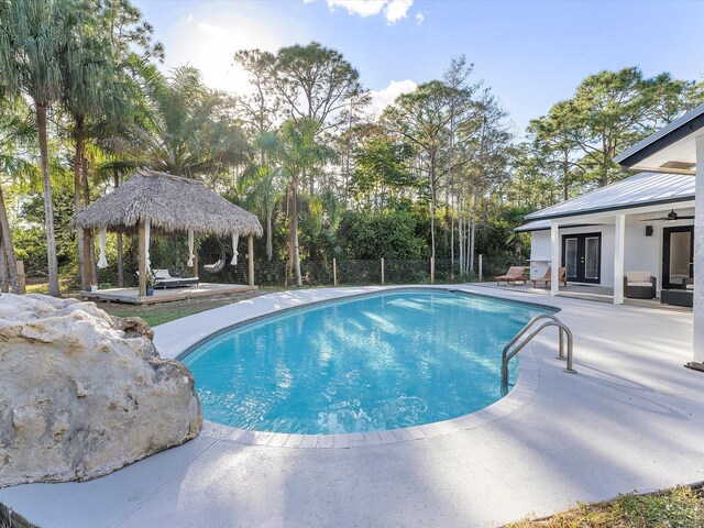 view of patio with a gazebo, an outdoor hangout area, and a deck