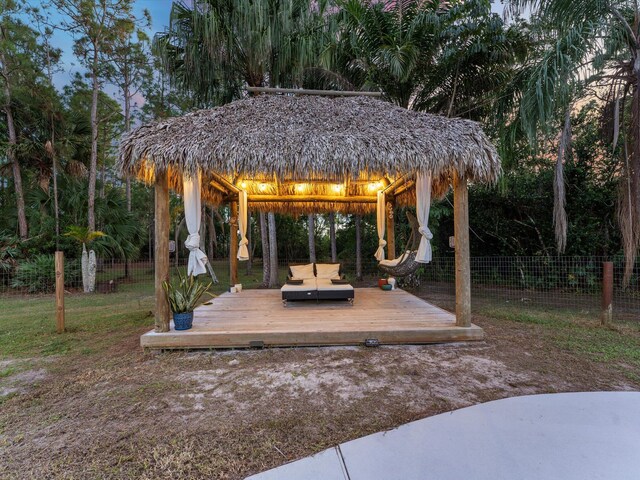 exterior space with a gazebo, a yard, and central AC