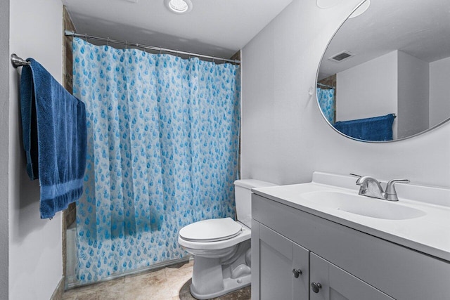 bathroom featuring vanity, toilet, and curtained shower