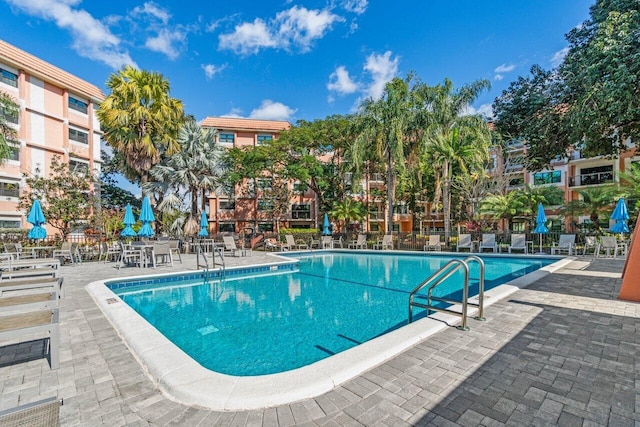 view of swimming pool with a patio area