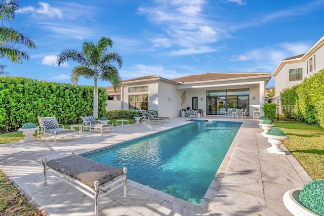 view of swimming pool featuring a patio