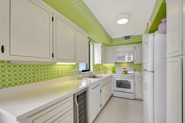 kitchen featuring white cabinets, white appliances, wine cooler, and sink