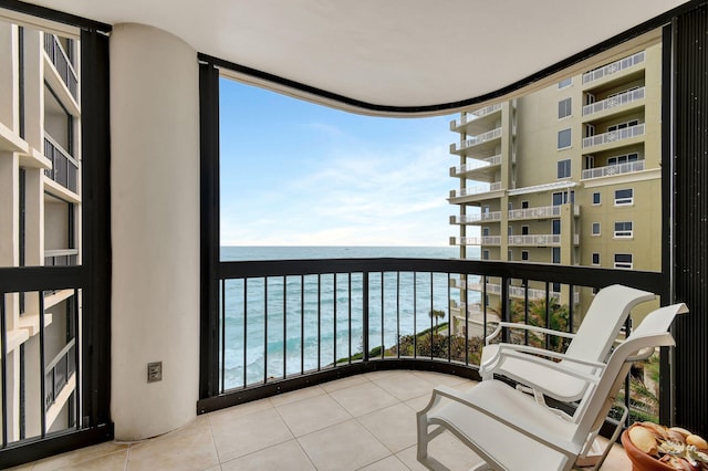 balcony featuring a water view