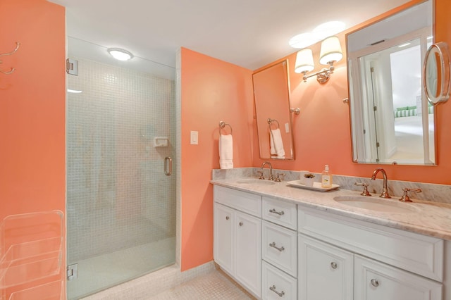 bathroom featuring vanity, tile patterned floors, and a shower with door