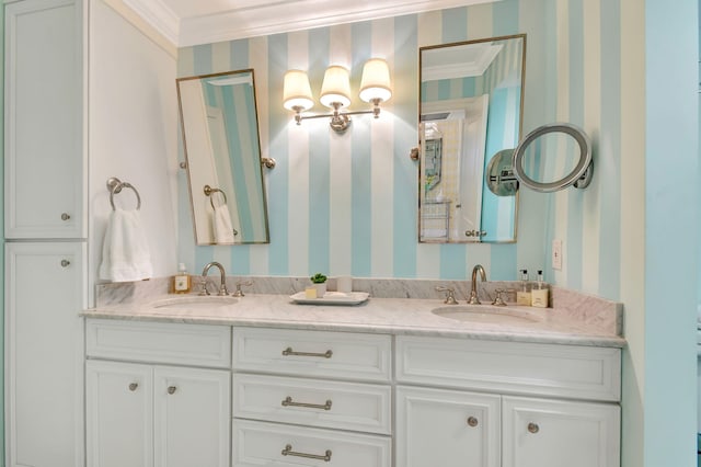 bathroom with crown molding and vanity