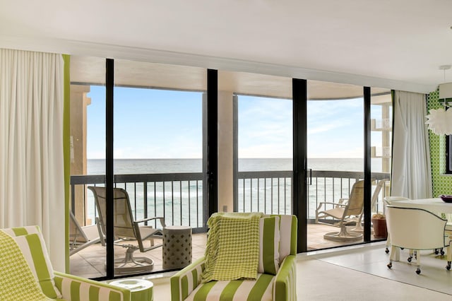 sunroom / solarium with a water view