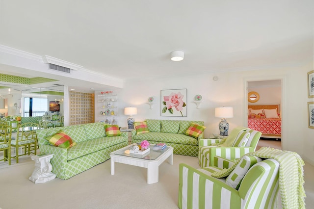 carpeted living room featuring ornamental molding