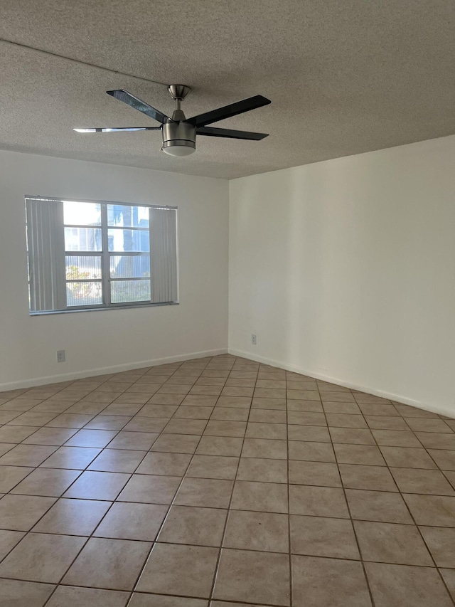 886 Flanders S, Delray Beach, FL 33484 - spare room with light tile patterned flooring, a ceiling fan, and a textured ceiling