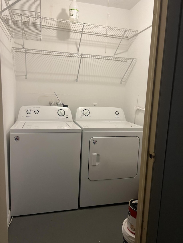 laundry room with separate washer and dryer