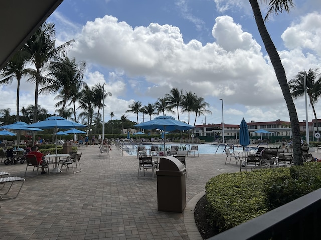 886 Flanders S, Delray Beach, FL 33484 - view of community with a swimming pool and a patio area