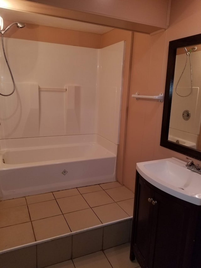 bathroom featuring tile patterned floors, tub / shower combination, and vanity