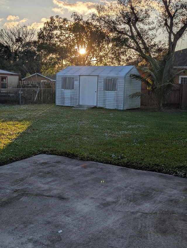 outdoor structure at dusk with a yard