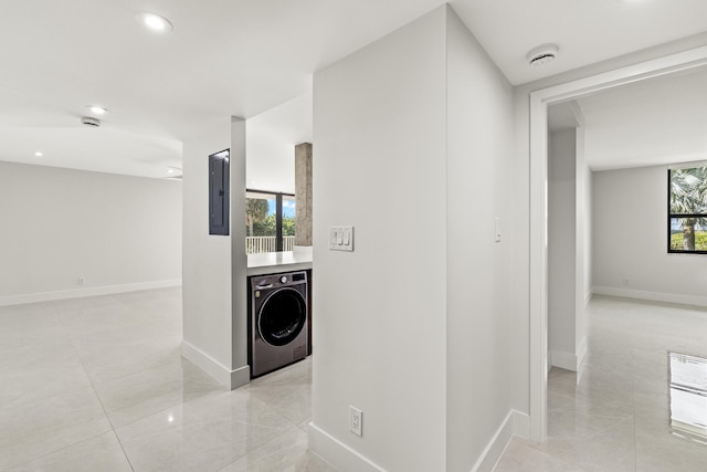 hall featuring washer / dryer and electric panel