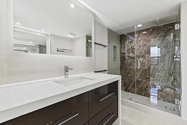 bathroom with vanity and an enclosed shower