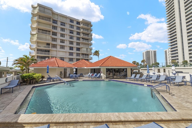 view of swimming pool featuring a patio area