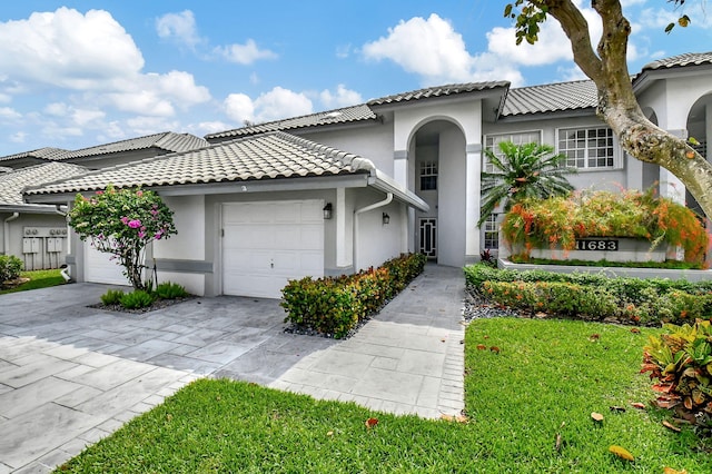 mediterranean / spanish-style house featuring a garage