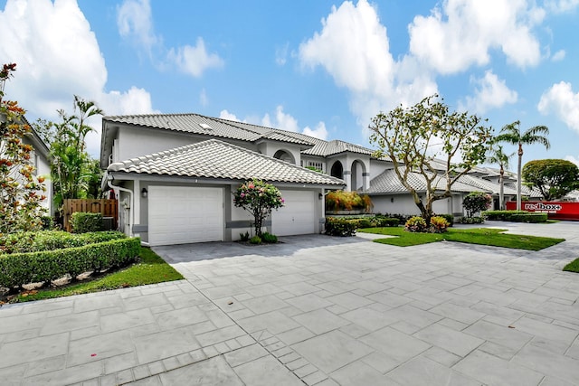 mediterranean / spanish house featuring a garage