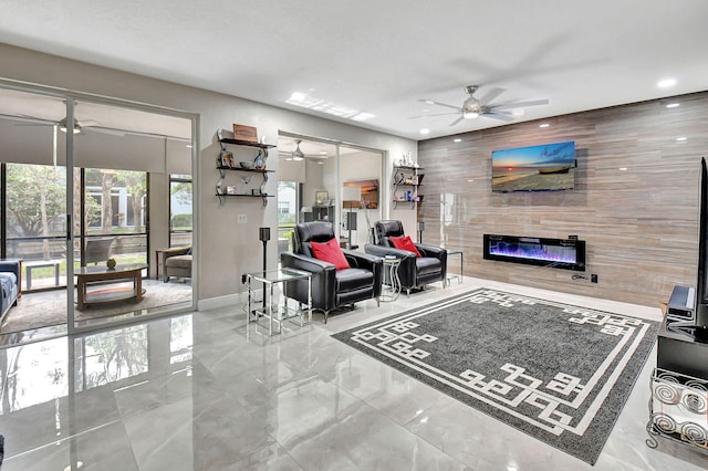 living room featuring ceiling fan and wooden walls