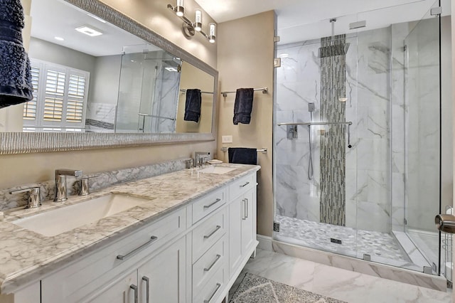 bathroom featuring vanity and a shower with shower door