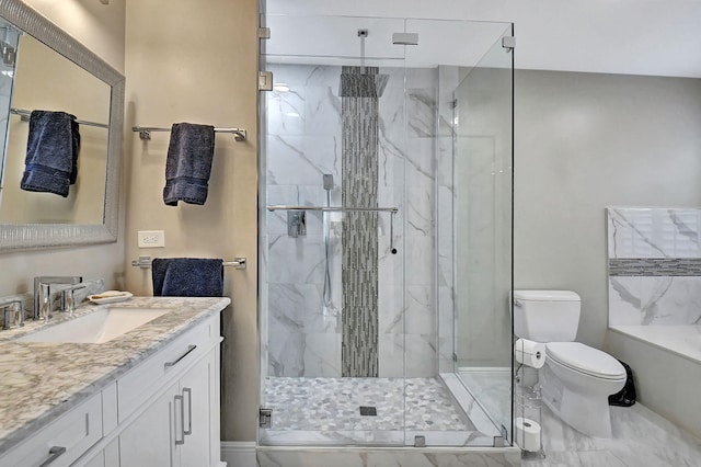 bathroom featuring vanity, toilet, and an enclosed shower