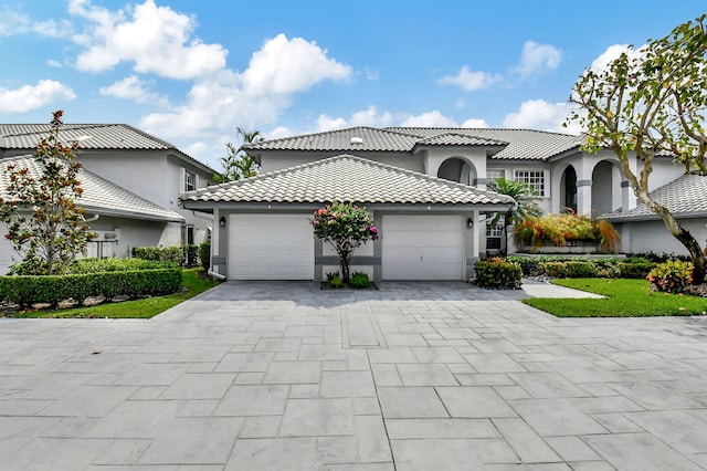 mediterranean / spanish-style house featuring a garage