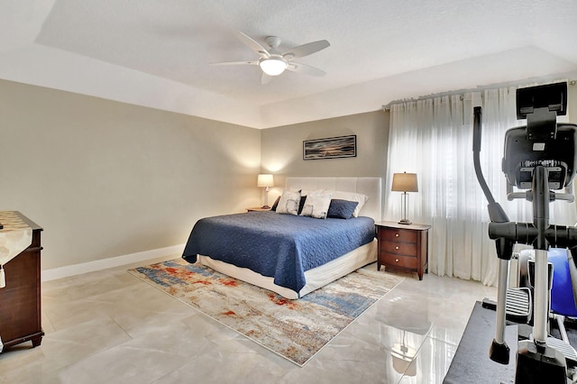 bedroom featuring a textured ceiling and ceiling fan