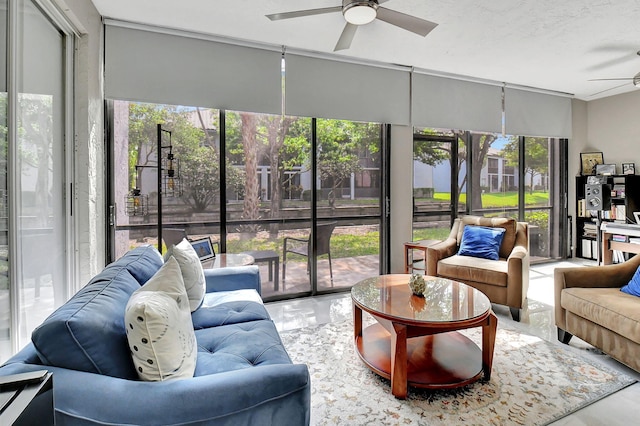 sunroom with ceiling fan