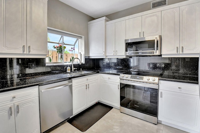 kitchen with white cabinetry, sink, and appliances with stainless steel finishes