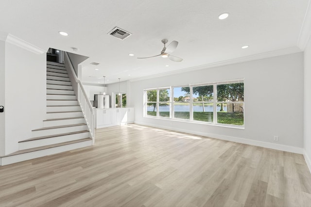 unfurnished living room featuring ceiling fan, light hardwood / wood-style flooring, a textured ceiling, and ornamental molding