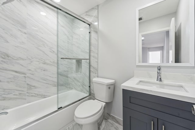 full bathroom with vanity, toilet, and bath / shower combo with glass door