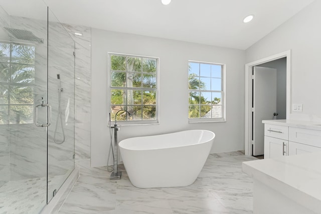 bathroom with plus walk in shower, vanity, and vaulted ceiling