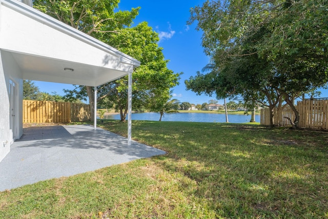 view of yard featuring a patio and a water view