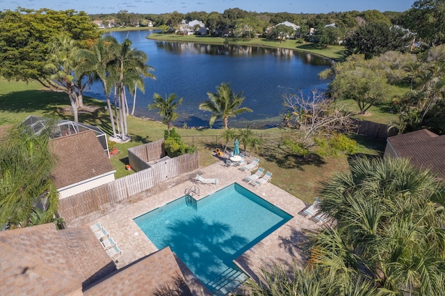 view of swimming pool featuring a water view and a patio