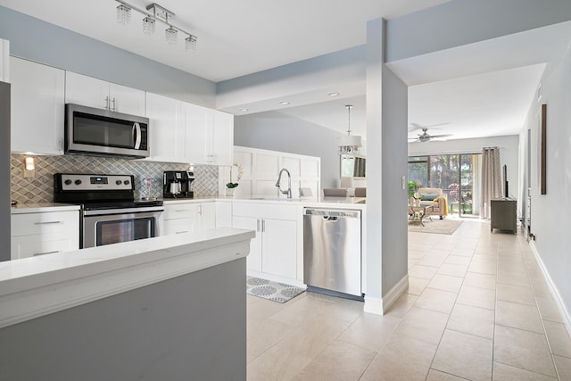 kitchen featuring white cabinetry, sink, and stainless steel appliances