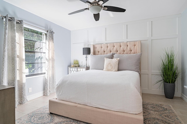 tiled bedroom with ceiling fan